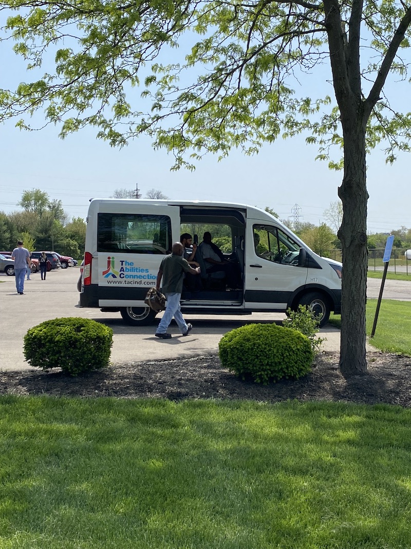 pentaflex employees boarding the tac vehicle after a shift